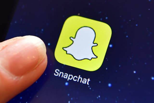 <p>A person clicks on the Snapchat app on their phone.</p>