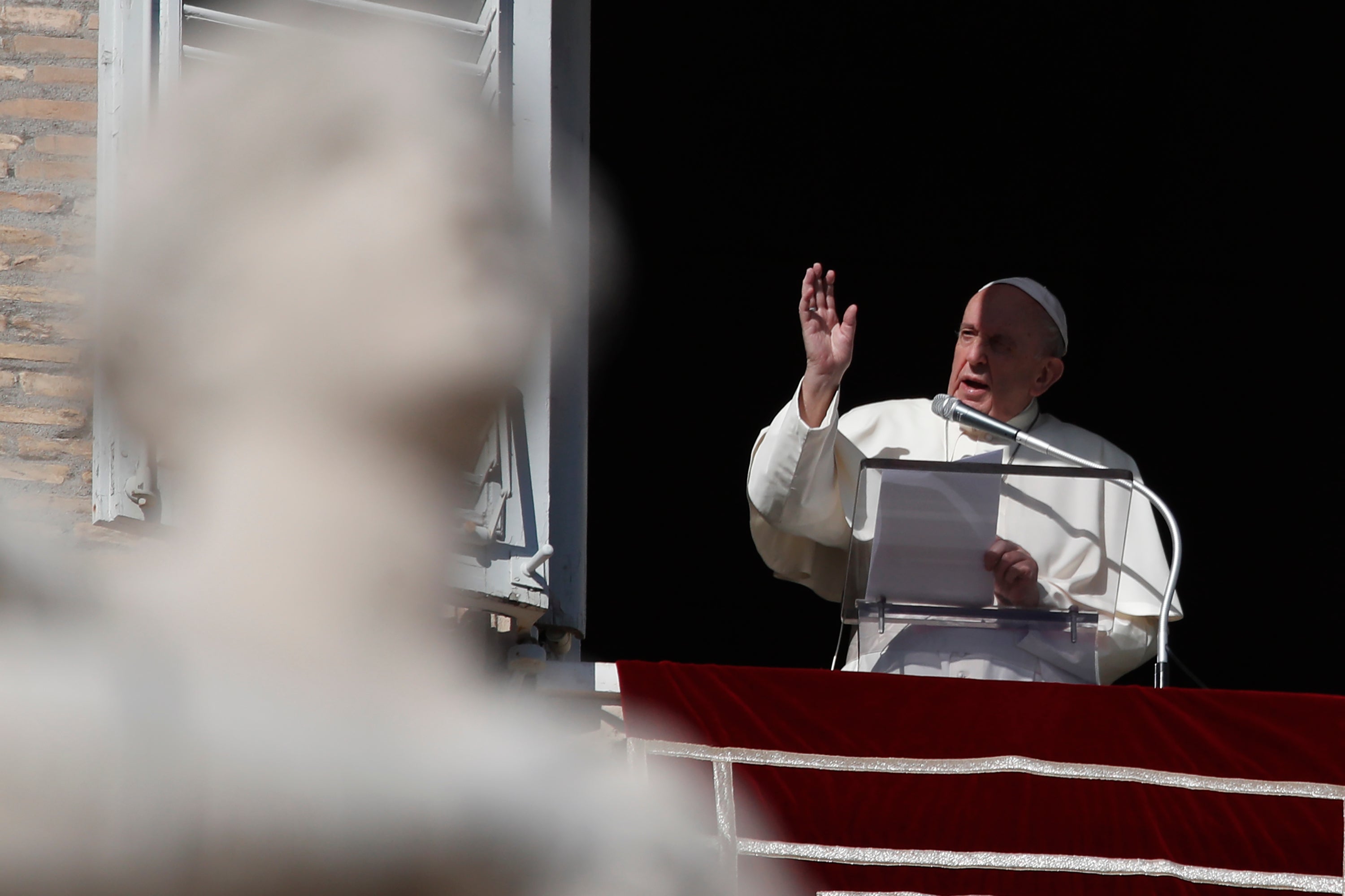 Pope Francis during the Angelus noon prayer he recited from the window of his studio overlooking St.Peter's Square, at the Vatican, Sunday, Nov. 22, 2020. (AP Photo/Alessandra Tarantino)