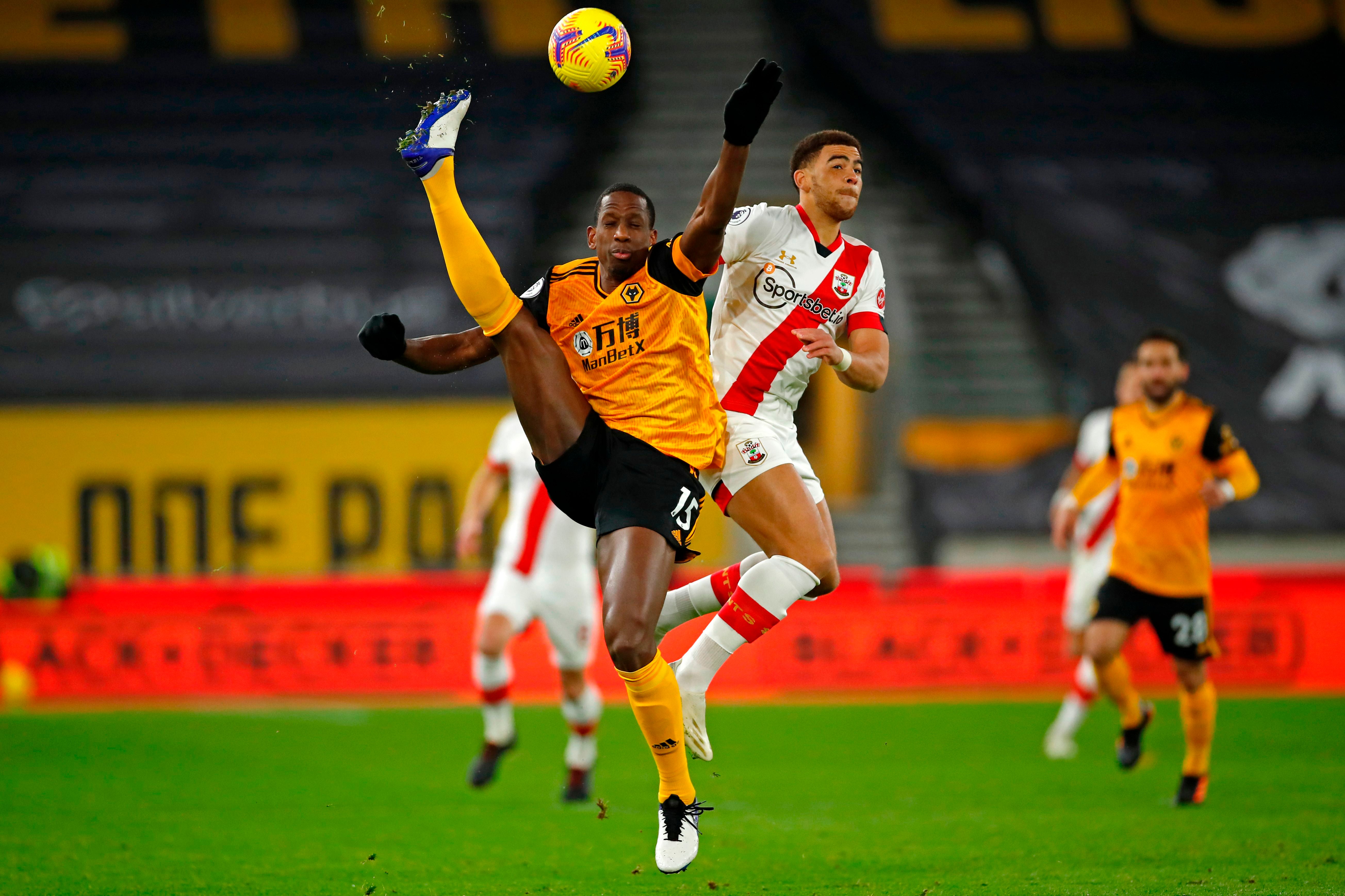 Willy Boly challenges for the ball