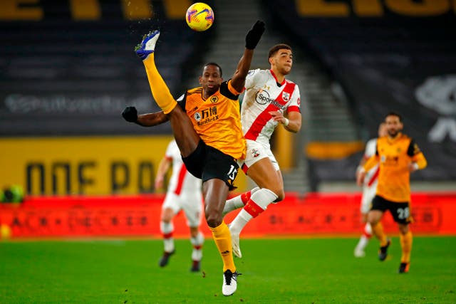 <p>Willy Boly challenges for the ball</p>