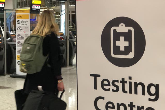 Testing times: a traveller at Heathrow  Terminal 2