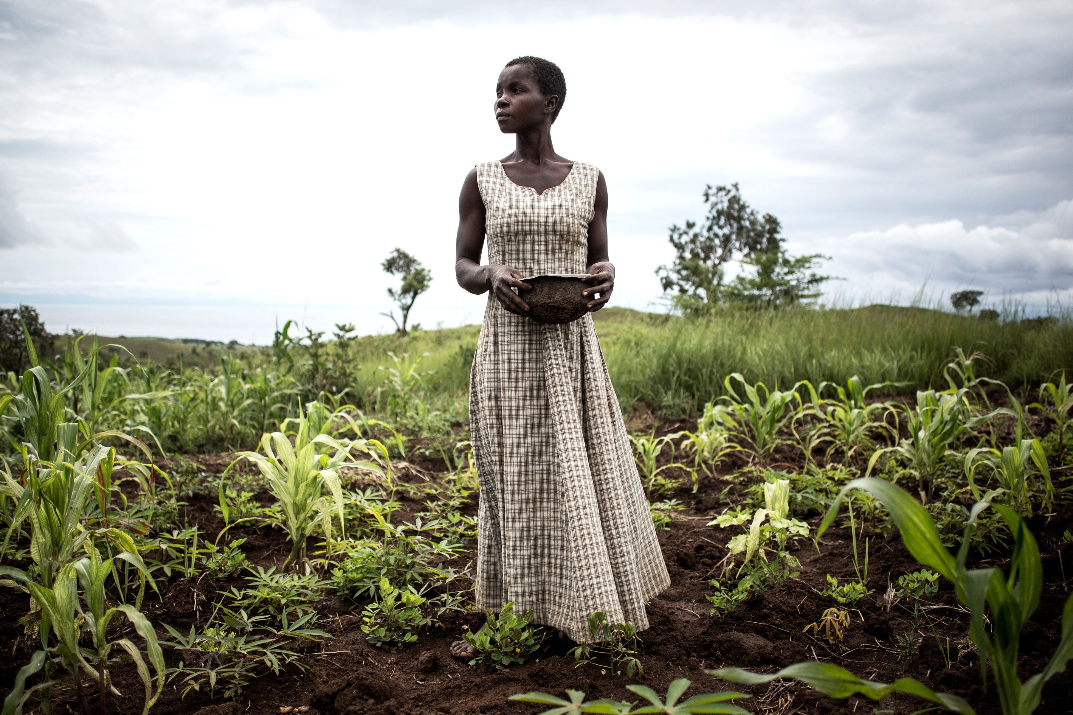 Woman plants seeds in Democratic Republic of the Congo