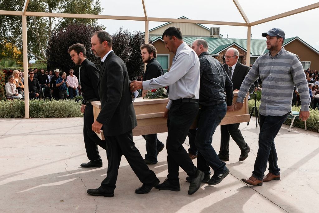<p>Relatives carry a coffin during the funeral service of Dawna Ray Langford, 43, and her sons Trevor and Rogan, who were among nine victims killed in the attack</p>