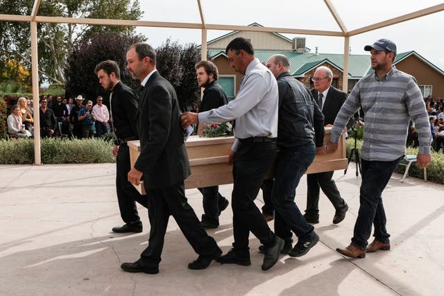 <p>Relatives carry a coffin during the funeral service of Dawna Ray Langford, 43, and her sons Trevor and Rogan, who were among nine victims killed in the attack</p>