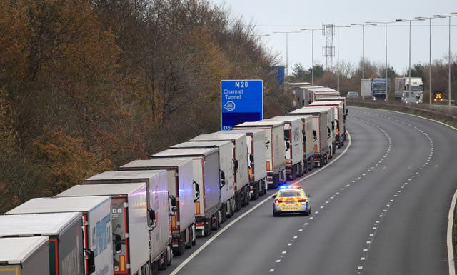 <p>Freight lorries queueing along the M20 in Kent waiting to access the Eurotunnel terminal in Folkestone</p>