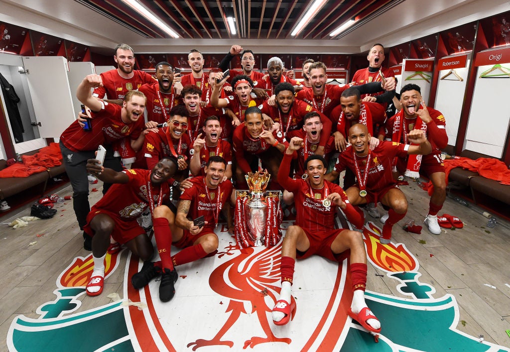 Liverpool celebrate with the Premier League trophy