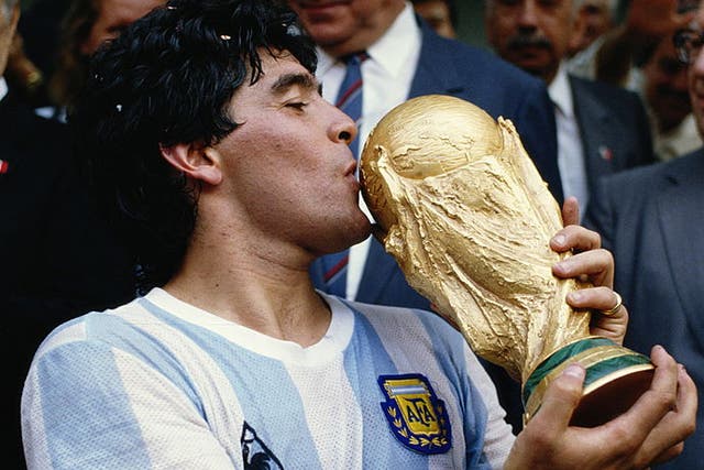 Diego Maradona celebrates winning the World Cup in 1986