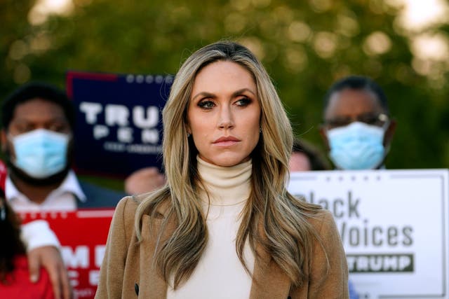 <p>Lara Trump, daughter-in-law of Donald Trump listens to Rudy Giuliani speak during a news conference on legal challenges to vote counting in Pennsylvania earlier this month</p>