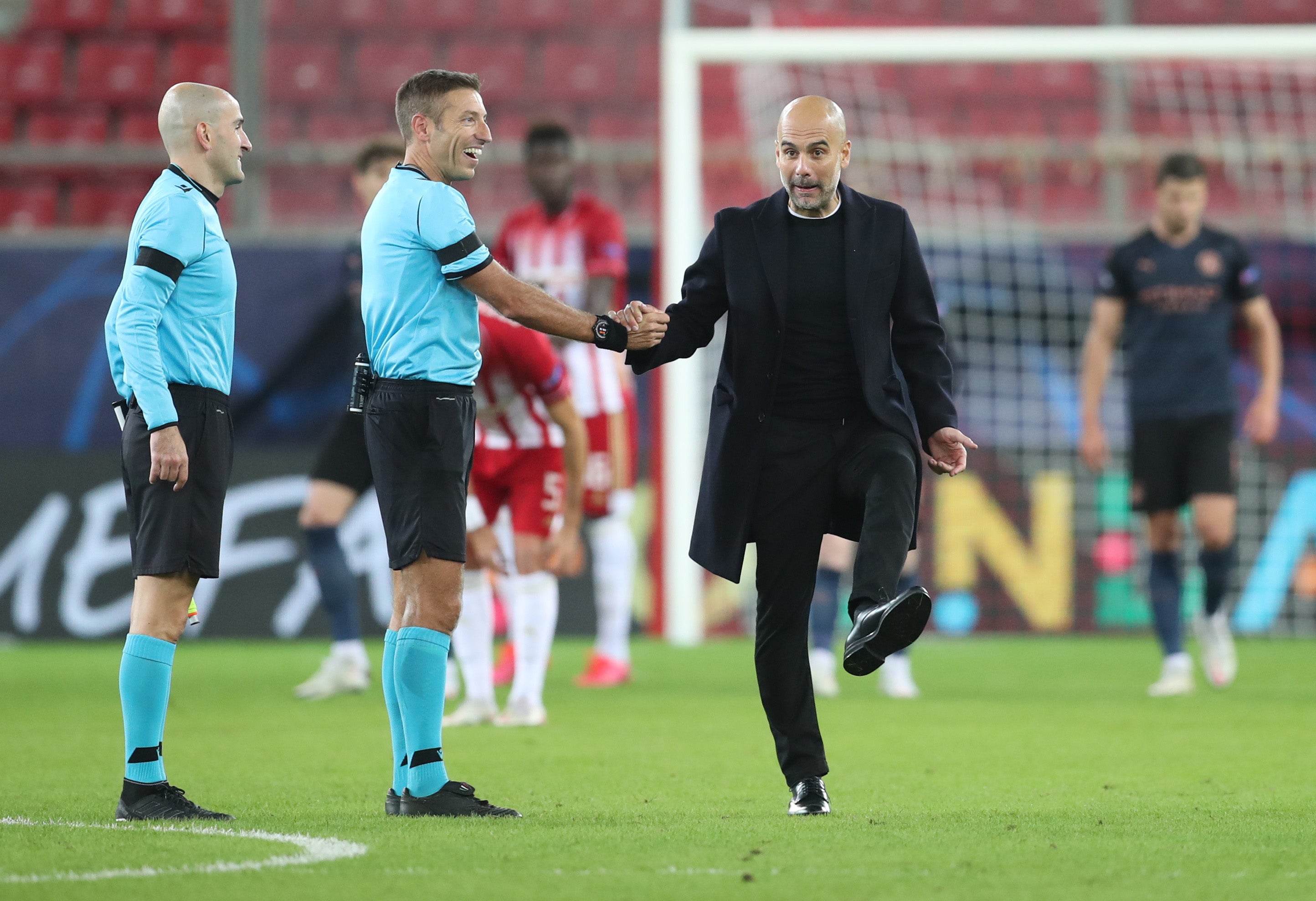Pep Guardiola speaks with the referee