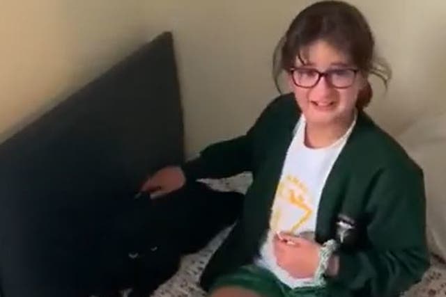 Screen grab from footage issued by Cats Protection of 10-year-old Katya Harmon, from Woking, being reunited with her cat Timmy after he had been missing for nine months