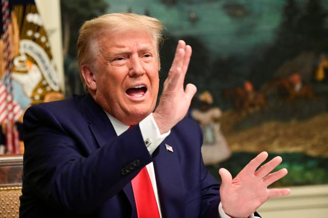 <p>President Donald Trump speaks to reporters at the White House on 26 November</p>