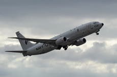 Search for missing pilot on after Indian military jet crashes into sea
