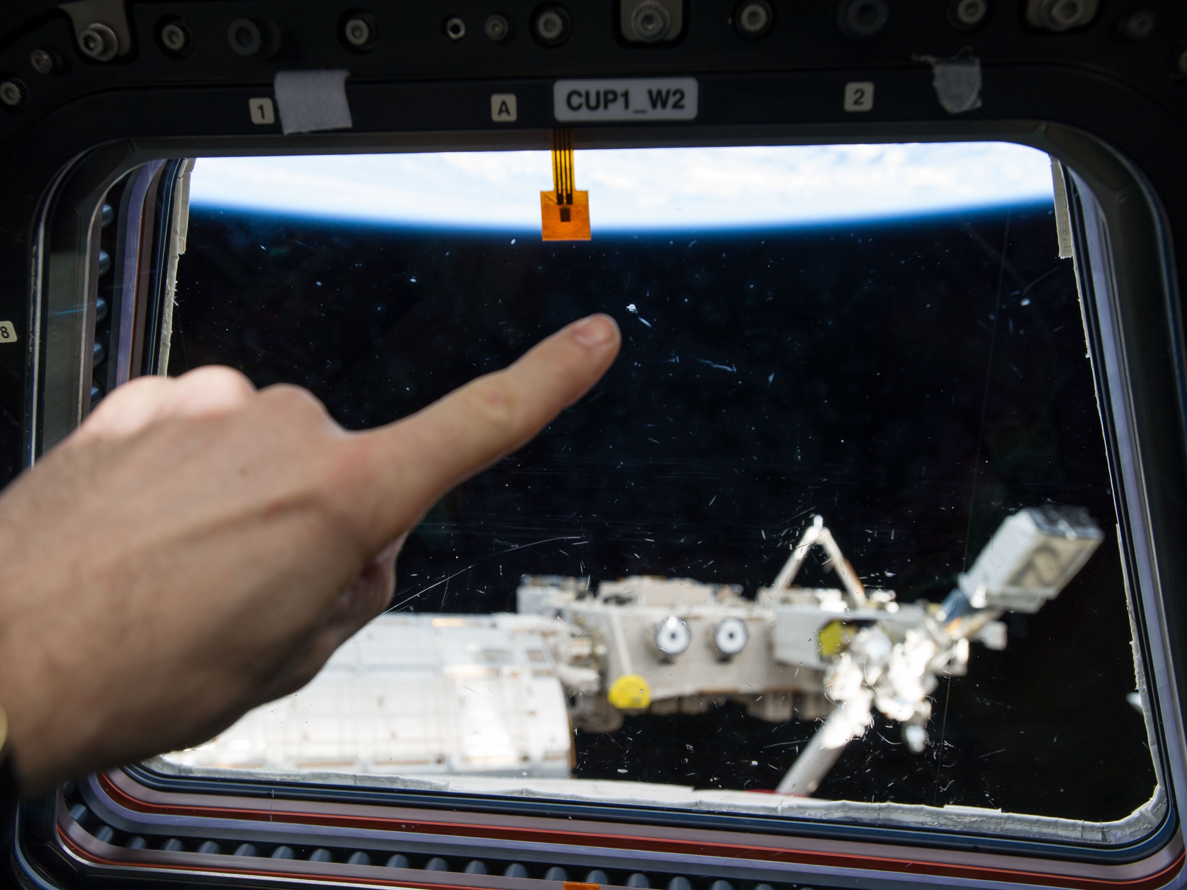 Small marks closeup were mistaken for distant unidentified flying objects from the ISS window