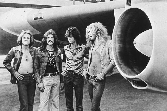 <p>John Paul Jones, John Bonham (1948 to 1980), Jimmy Page and Robert Plant in front of their private airliner, The Starship, 1973</p>