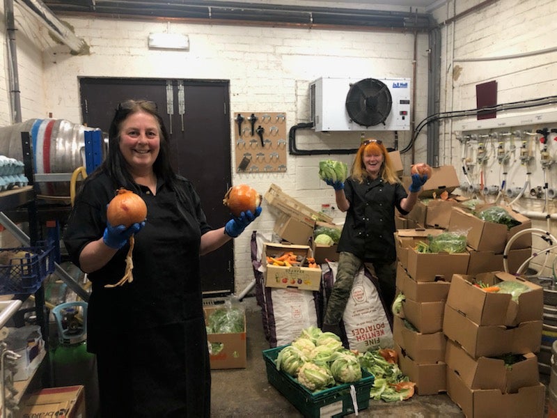 Volunteers at the Bevy pub take a delivery of surplus veg for their meals on wheels service