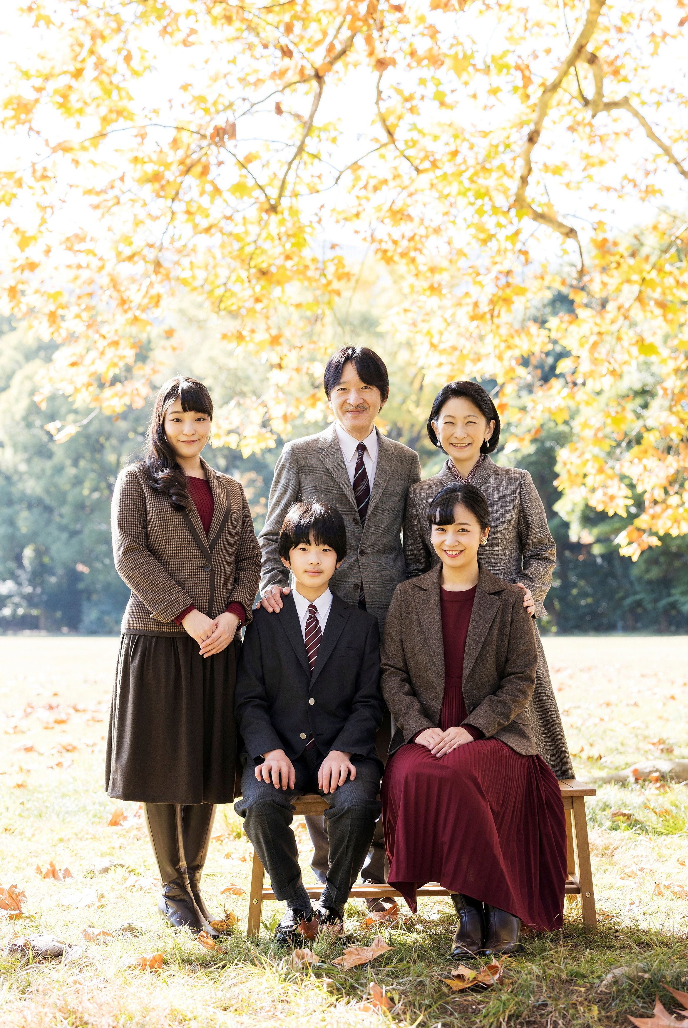 Japan’s Crown Prince Akishino (behind C) with his wife Crown Princess Kiko (behind R) and their children.