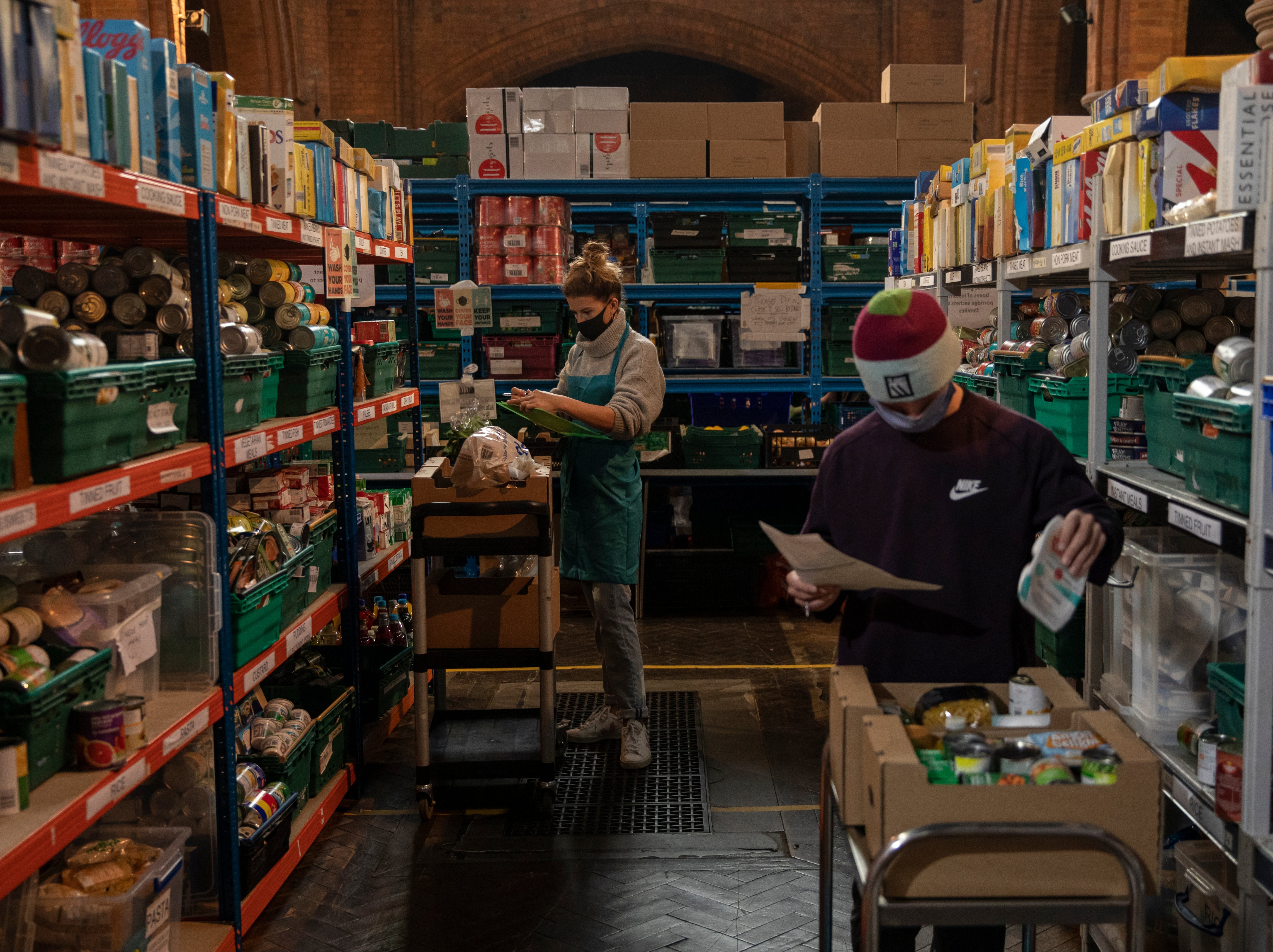 Staff and volunteers pack food parcels at the Norwood and Brixton foodbank at St Margaret’s Church, which is supported by The Trussell Trust