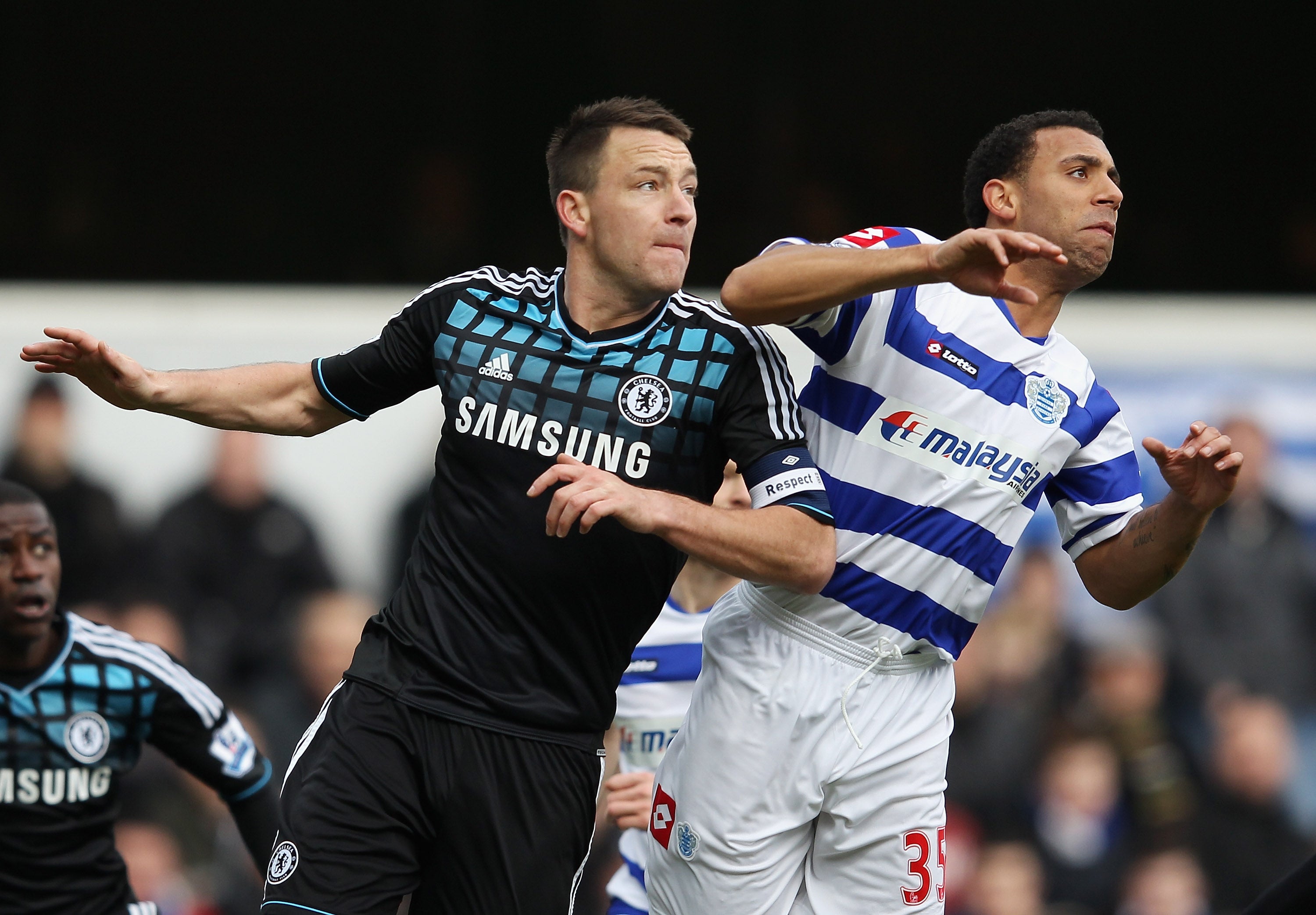 Anton Ferdinand goes up for a header against John Terry