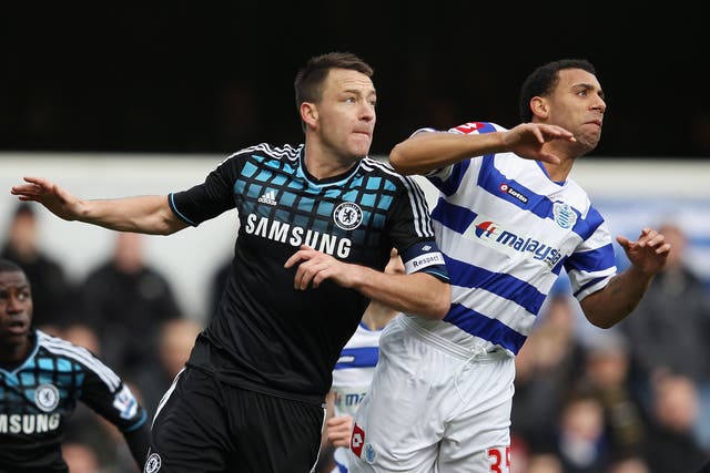 John Terry, left, and Anton Ferdinand competing for the ball