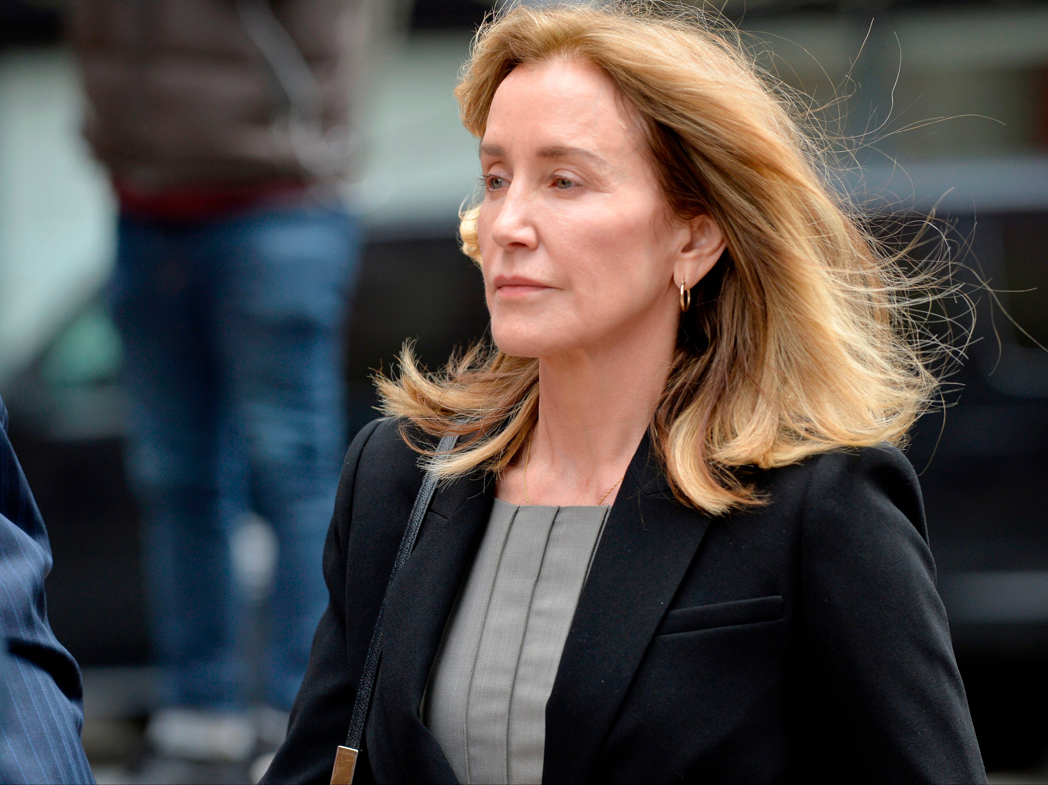 Felicity Huffman arrives at a court hearing in Boston, Massachusetts, in 2019