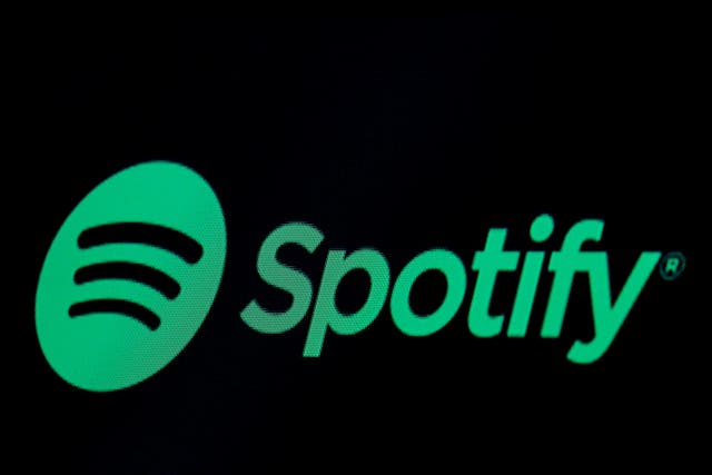 The Spotify logo, displayed on a screen on the floor of the New York Stock Exchange