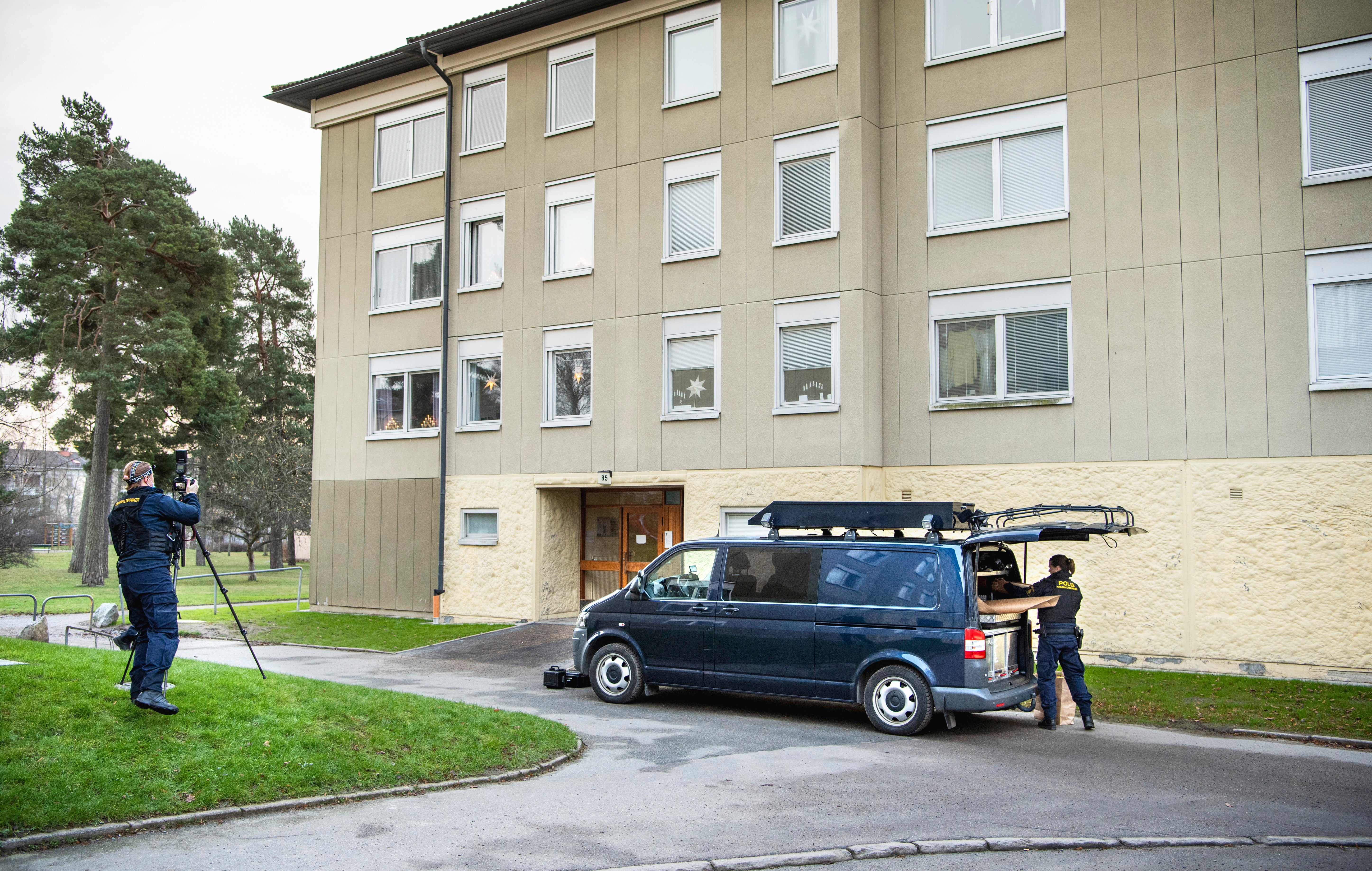Police at the apartment block in Stockholm where a woman allegedly locked up her son for three decades