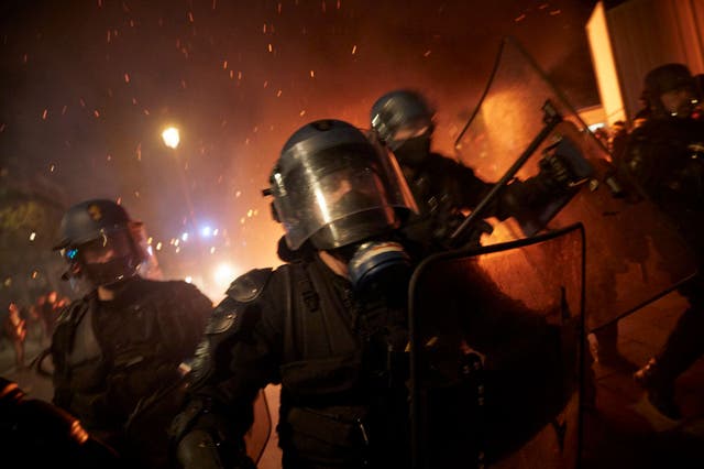 <p>French riot police charge towards protesters at Place de la Bastille as demonstrations against the French government’s global security law turn violent</p>