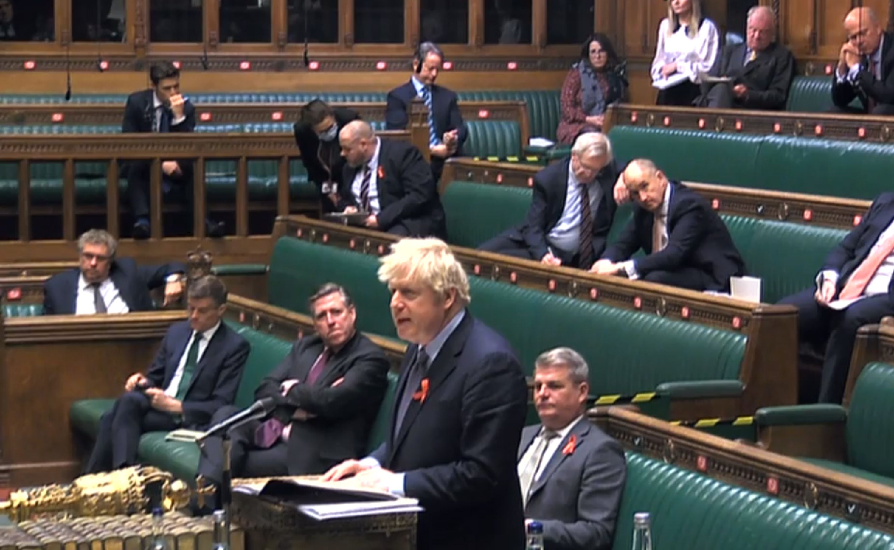 Boris Johnson was surrounded in the Commons by Tory MPs sceptical of his virus plans