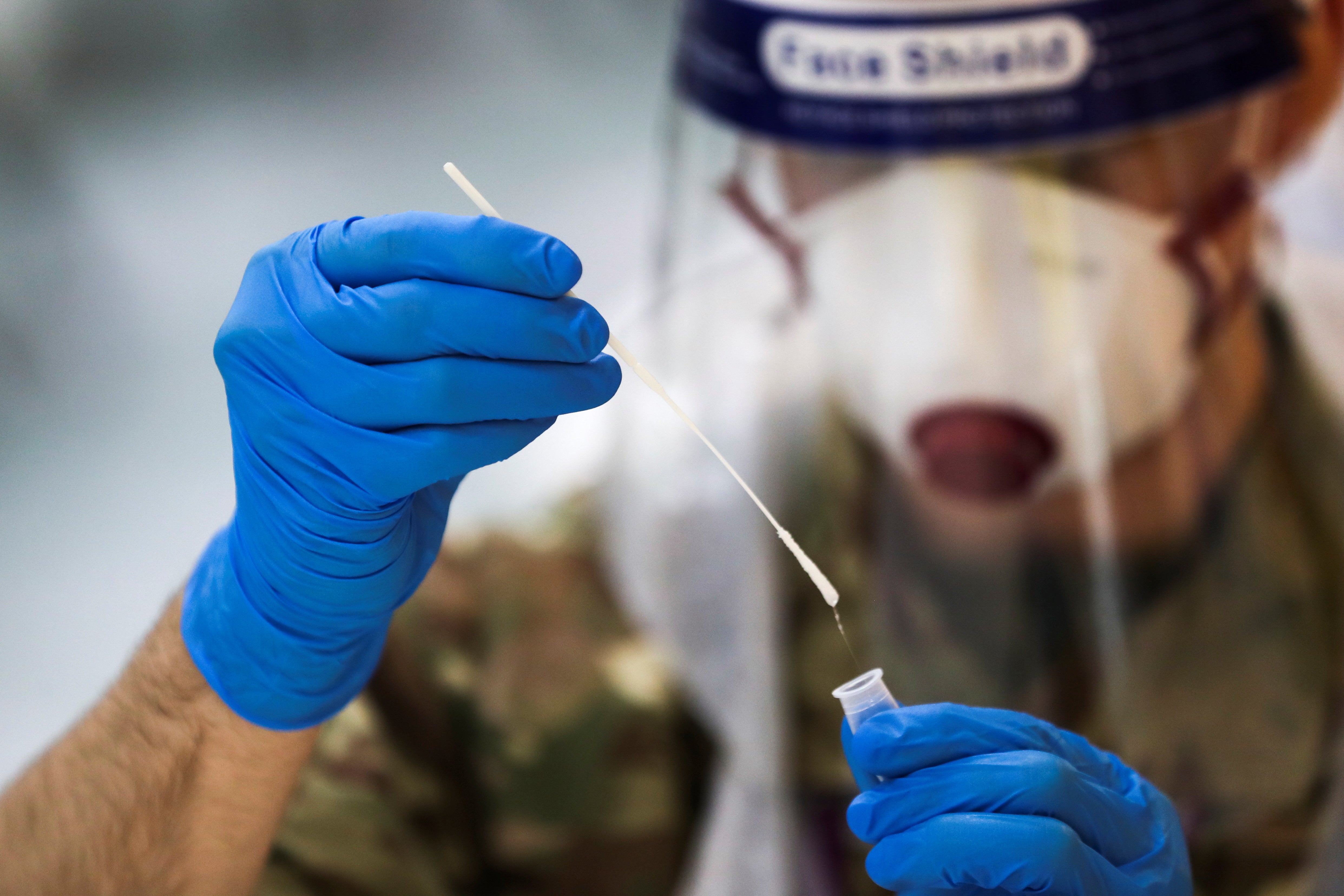 A soldier administers a lateral flow coronavirus test