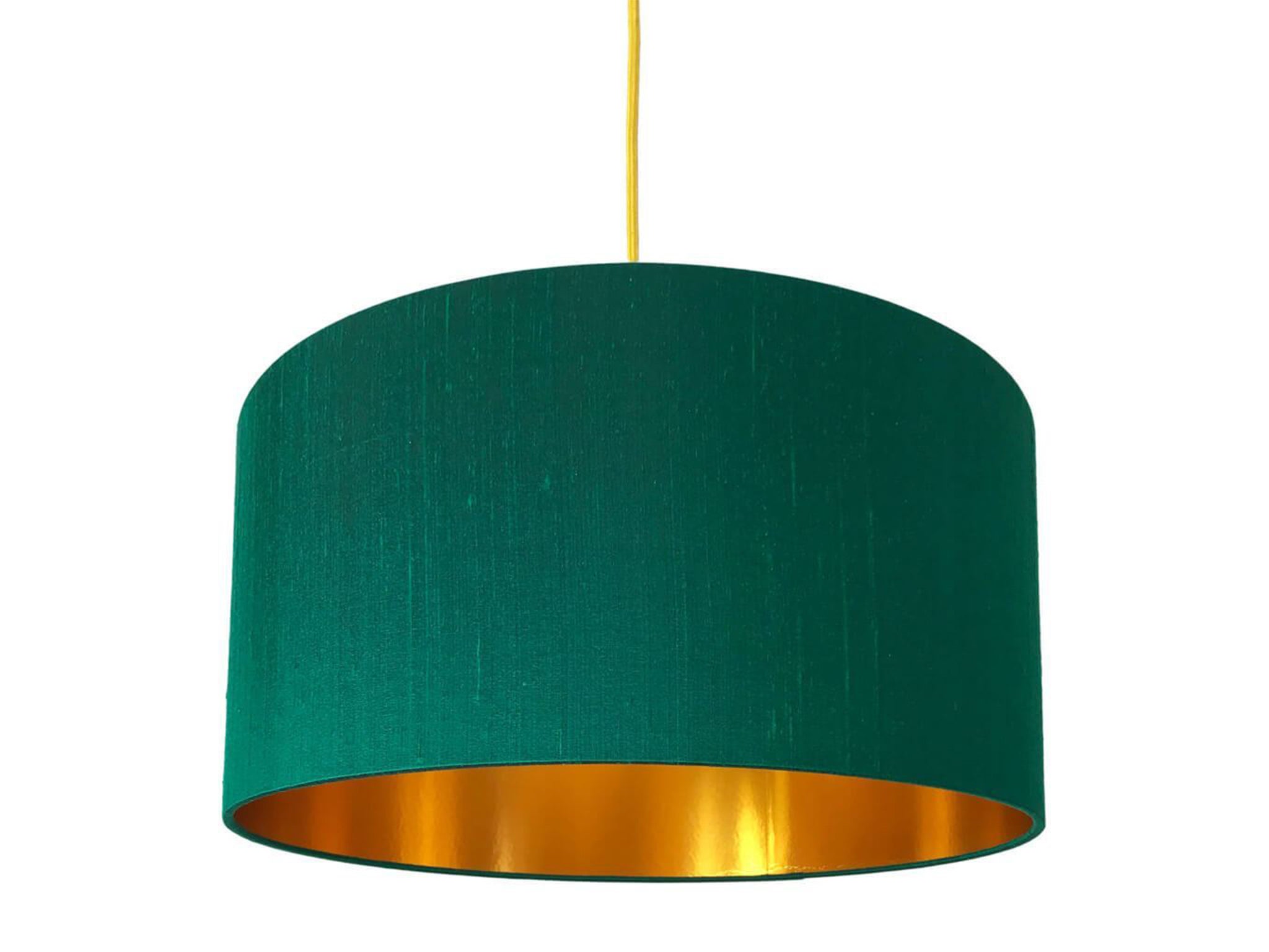 Decadent and fun, a gold lined lamp adds a warm yellow glow