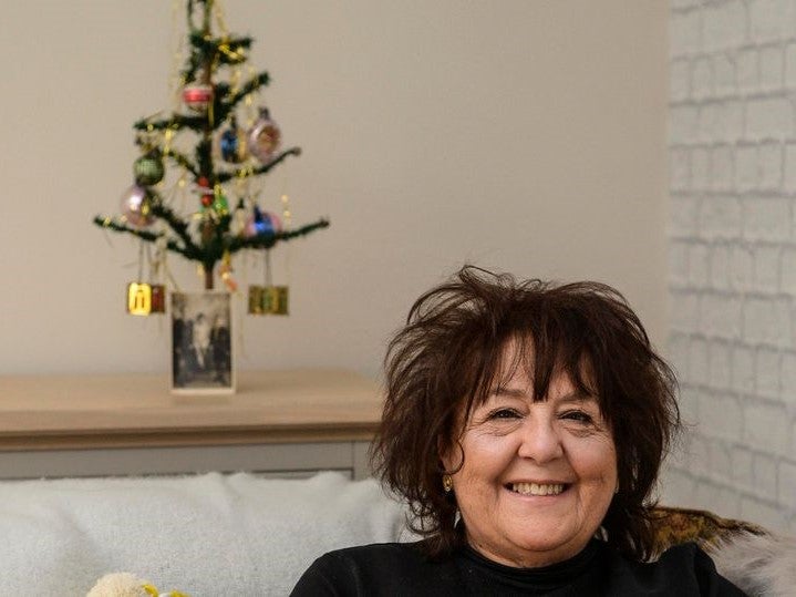 Kay Ashton and 100-year-old Christmas tree