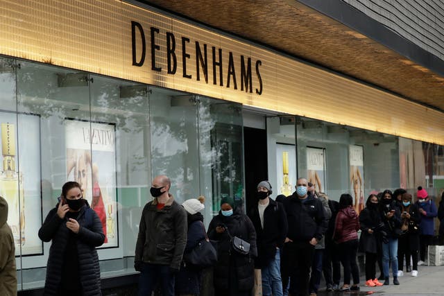 <p>People queue up waiting for Debenhams on Oxford Street to reopen</p>