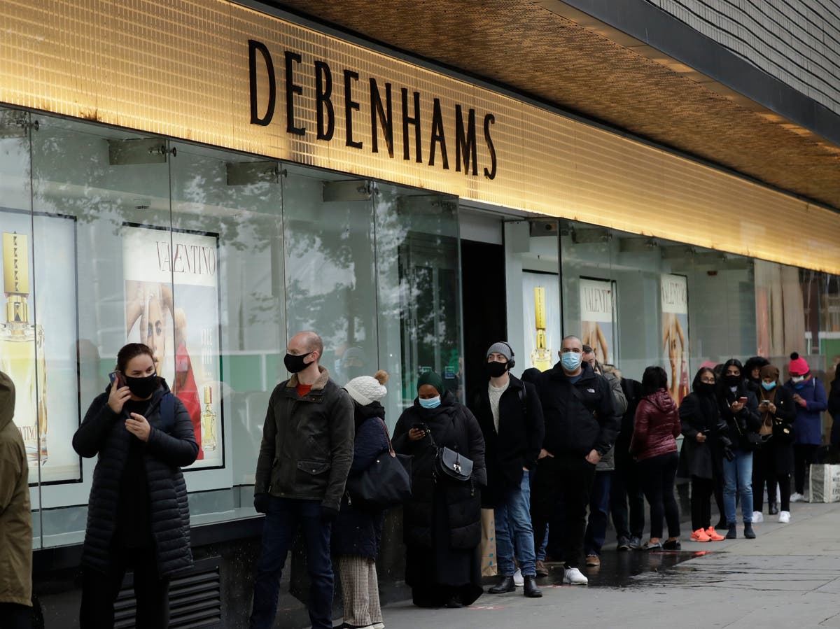 Shoppers queue outside non-essential shops from 7am as lockdown ends