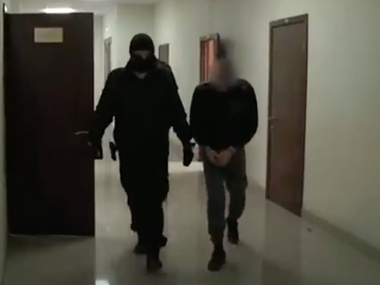 Radik Tagirov, who was arrested on suspicion of killing 26 elderly women, is pictured in custody in Russia.