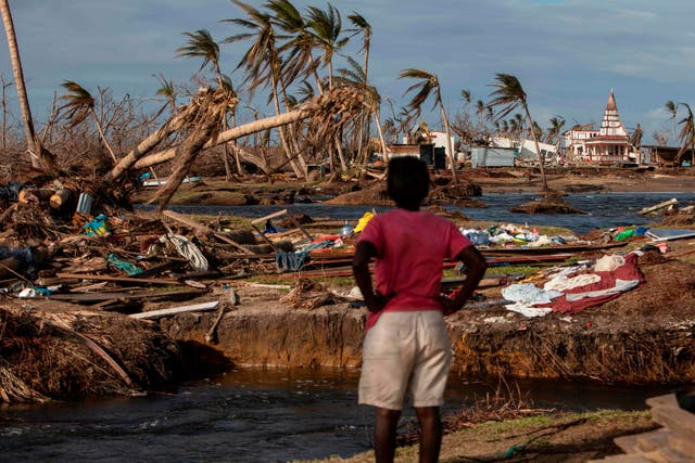 A woman looks at the destruction in Haulover, Nicaragua, on November 28, 2020, days after the passage of Hurricane Iota. Hurricanes Eta and Iota, which hit Nicaragua on November 3 and 16 respectively, left at least 200 confirmed dead and as many missing
