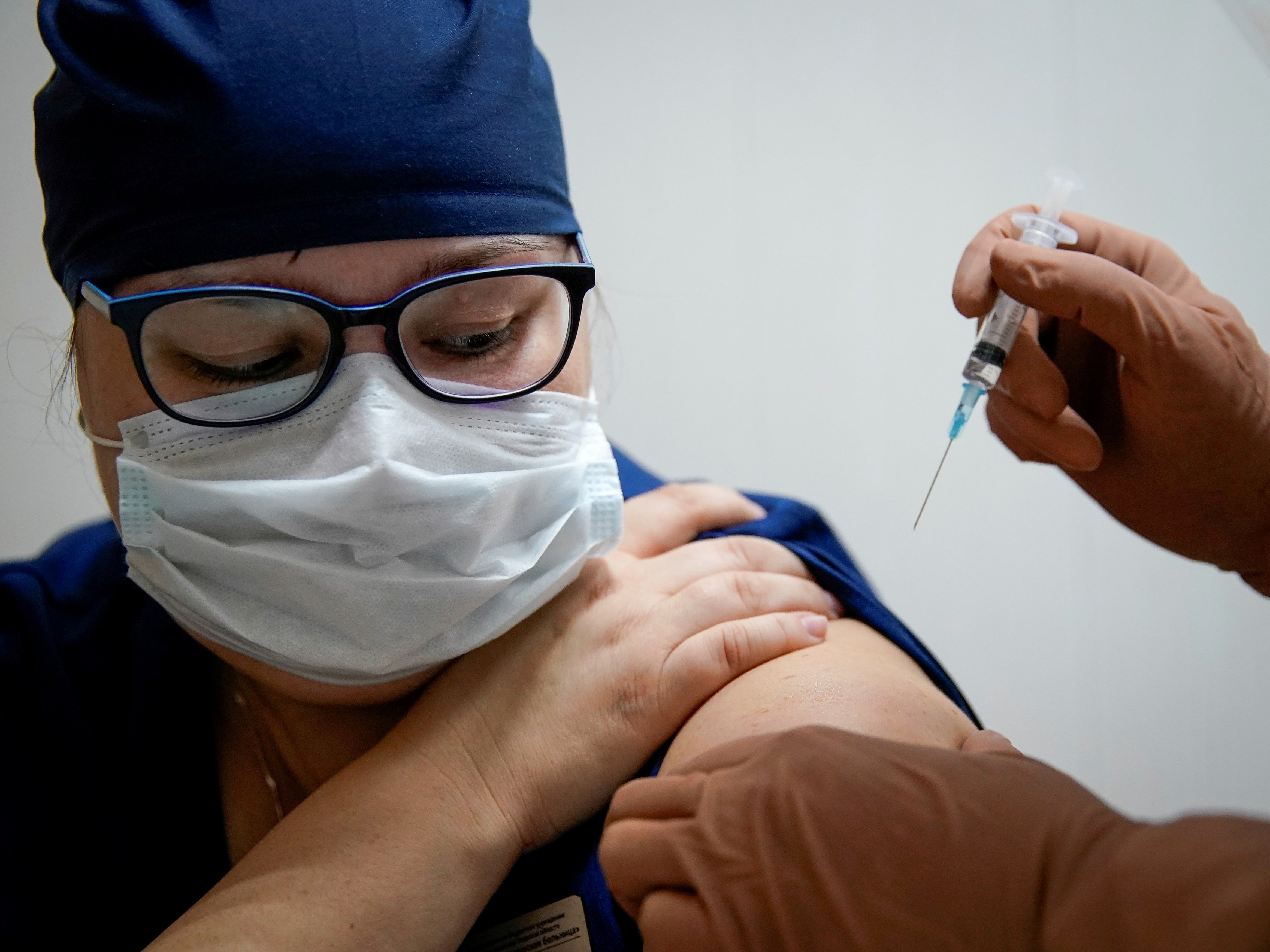 A medic received Russia’s ‘Sputnik V’ Covid-19 vaccine