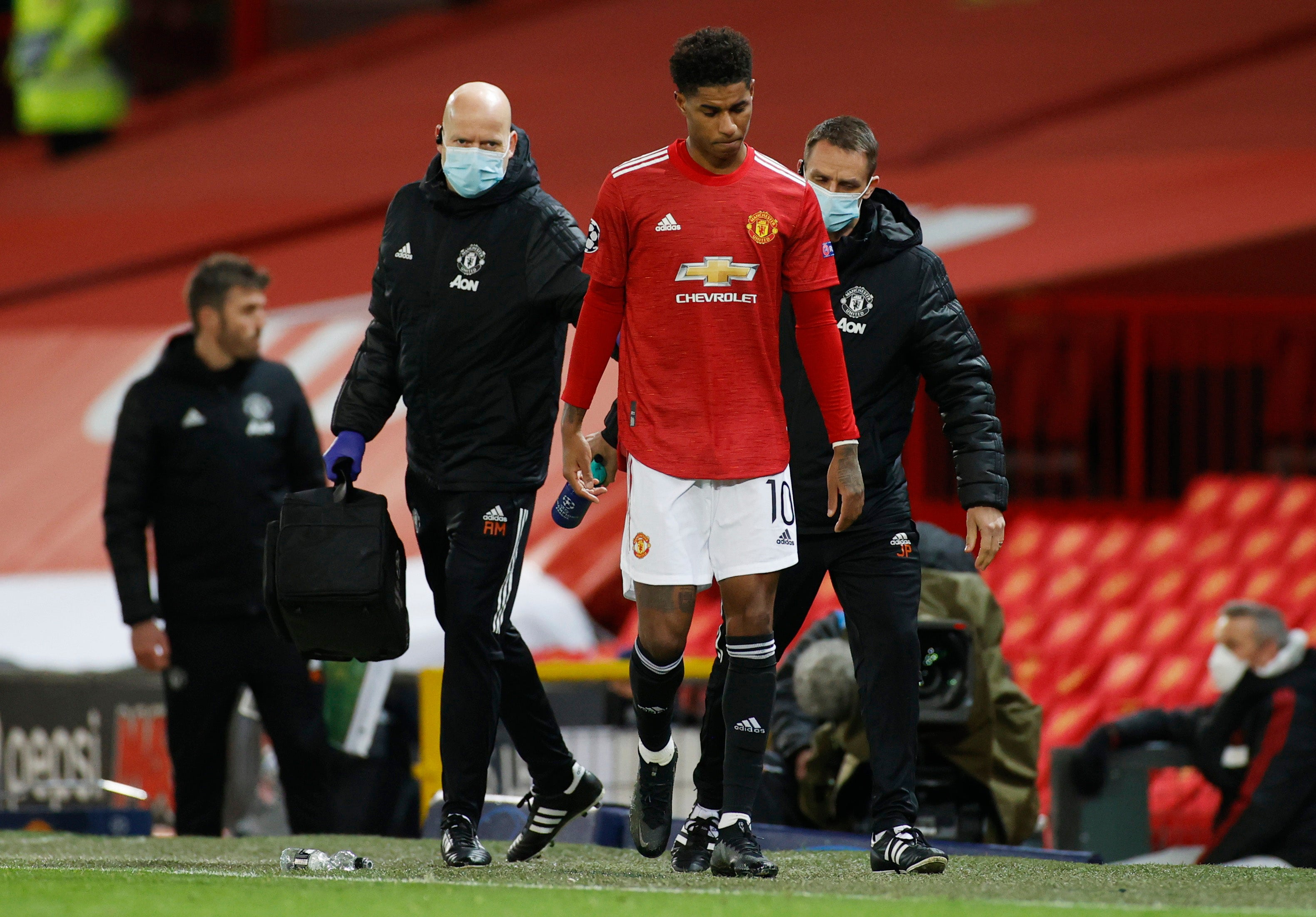 Marcus Rashford leaves the pitch with an injury