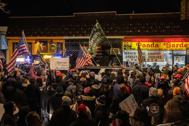 People protest outside of the Mac’s Public House after closed it down as the Covid-19 pandemic in the Staten Island borough of New York City, on 2 December 2020