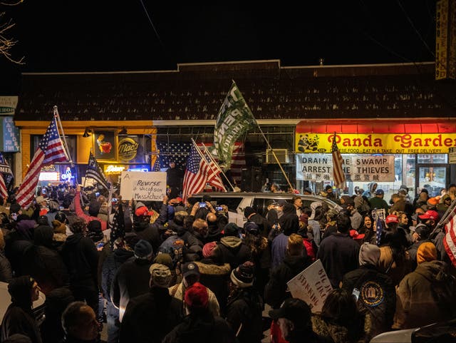 People protest outside of the Mac’s Public House after closed it down as the Covid-19 pandemic in the Staten Island borough of New York City, on 2 December 2020