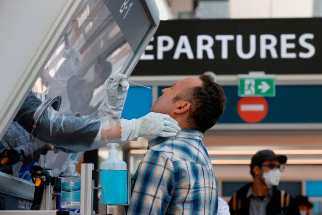 <p>A man is tested for coronavirus at Israel’s Ben Gurion International Airport</p>