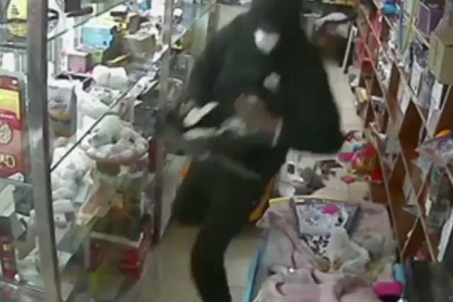 Video released by New York police, showing robbery on bodega 