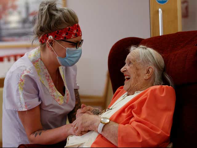 <p>Carer Lucy Skidmore decided to stay on site at a care home in Princes Risoborough with six colleagues to reduce the risk of bringing Covid-19 into the home. Here she spends time with her 100-year-old great-grandmother and resident Joan Loosley</p>