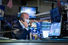 Asian stocks lower after Pfizer cuts vaccine shipment plans