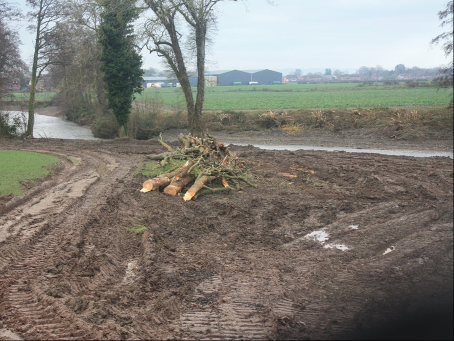 The bank along the River Lugg has been stripped bare and ploughed into bare mud
