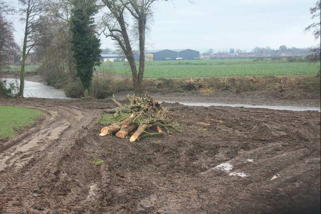 The bank along the River Lugg has been stripped bare and ploughed into bare mud