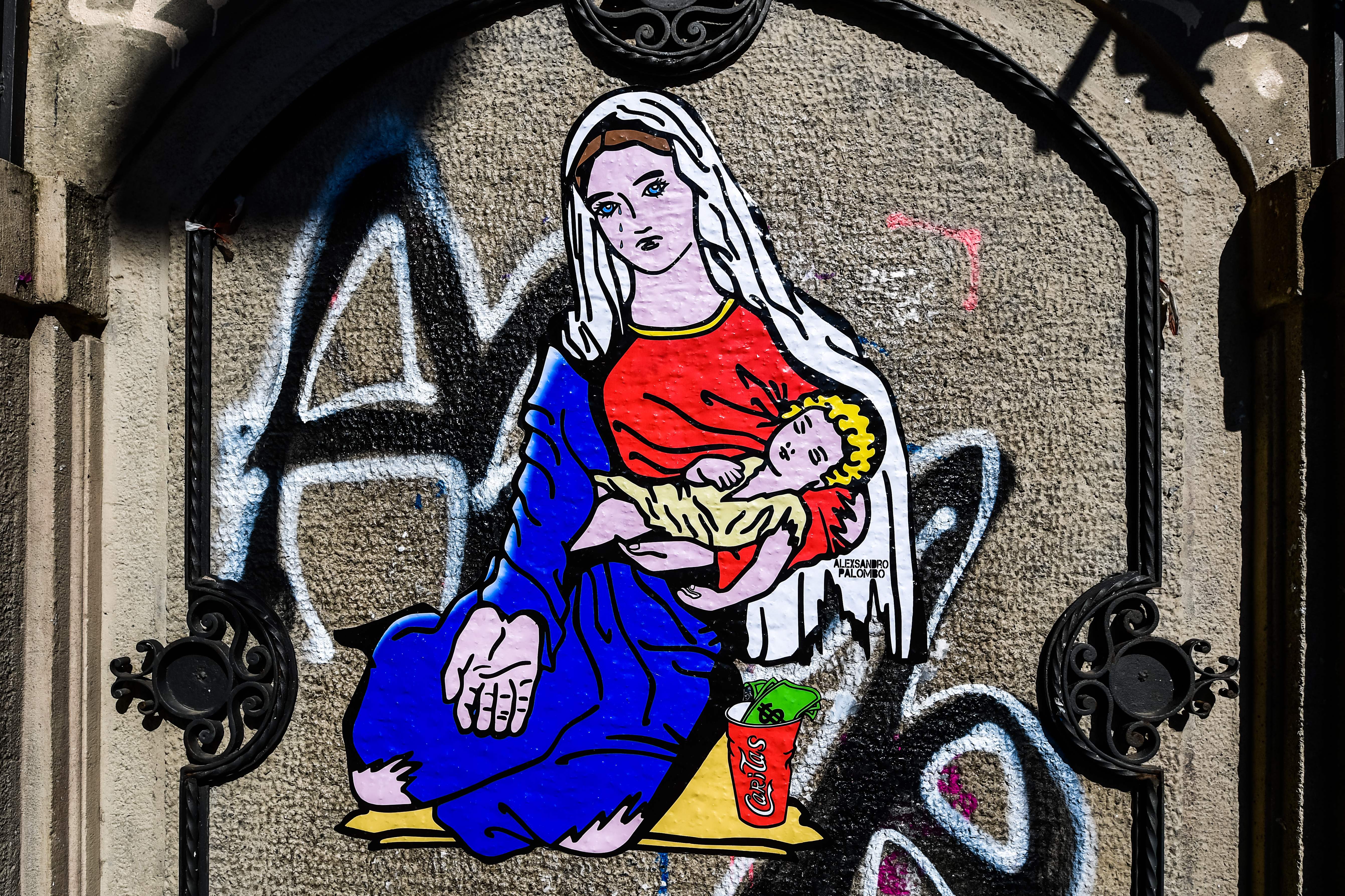 Street art in Milan highlighting issue of poverty in the city