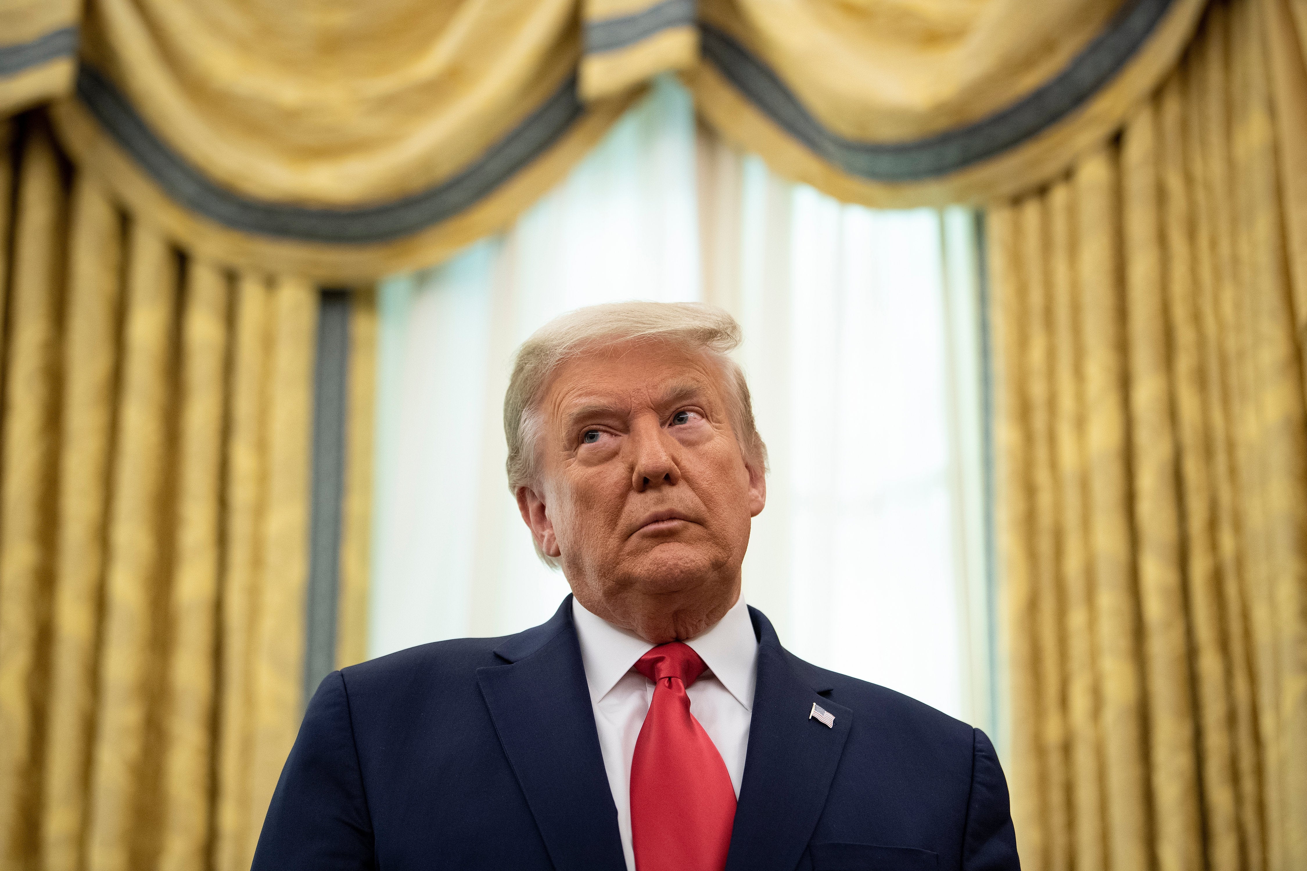 <p>Donald Trump, pictured on Friday, is being sued by 20 plaintiffs over an alleged fraud scheme involving thousands of tenants in apartment buildings built by his father</p>