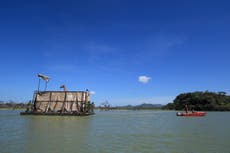 Rescue barge saves two giraffes from flooded island