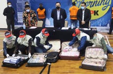 Indonesia minister turns himself in for COVID-19 aid graft