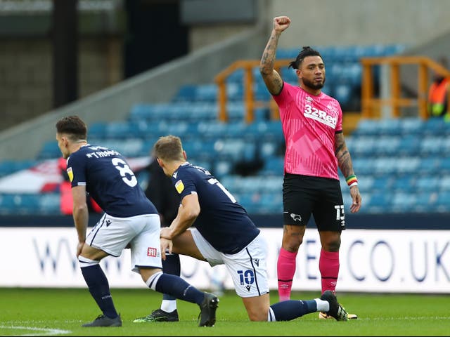 Millwall and Derby County players were booed by fans for taking the knee
